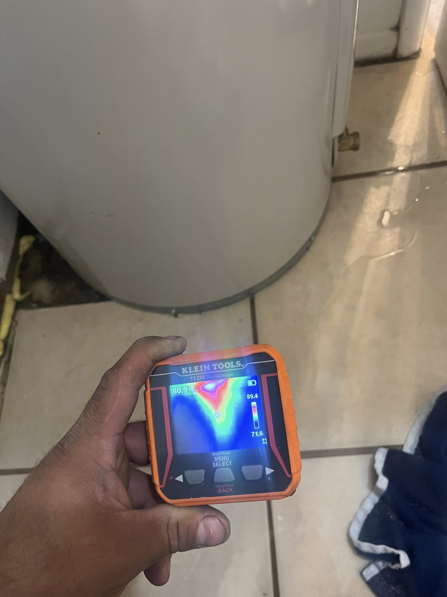 a hand holding a device with a screen