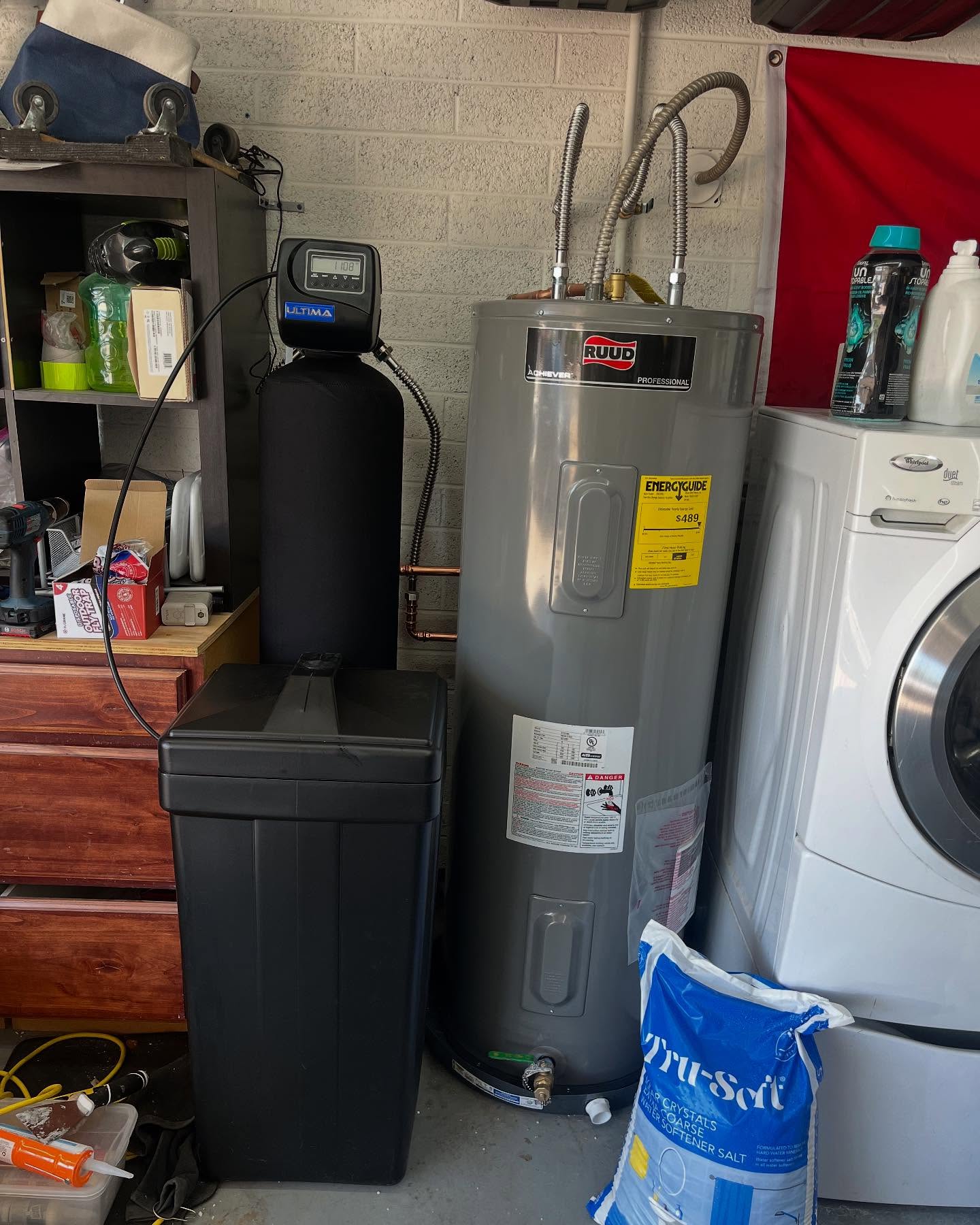 a water heater next to a washing machine