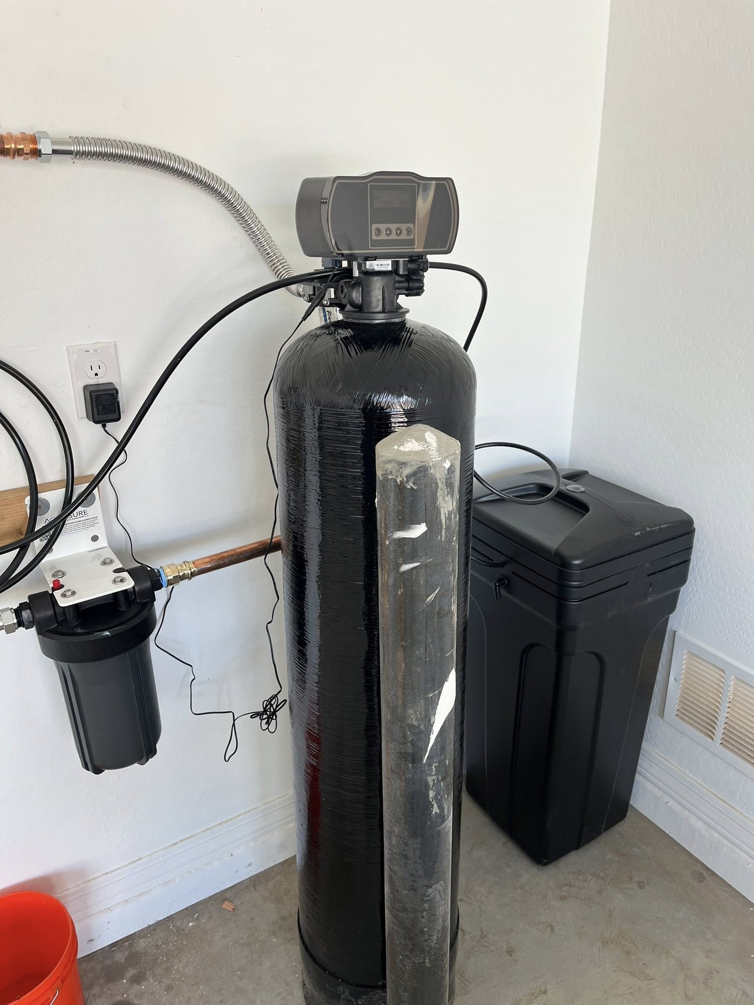 a black cylinder with a digital device attached to it